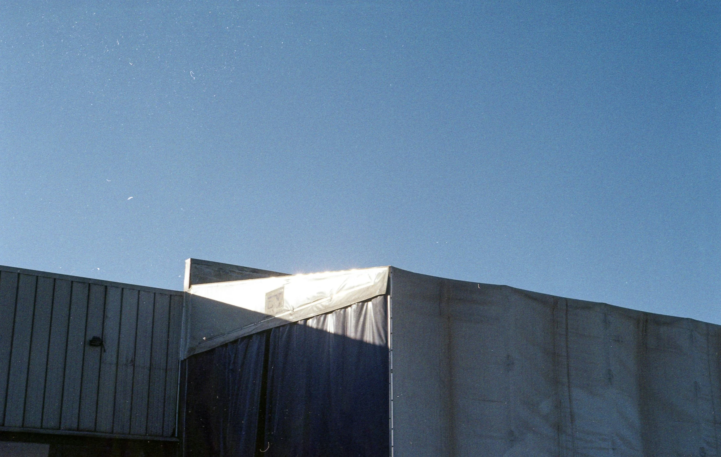 view of the roof from an enclosed space on top of a building