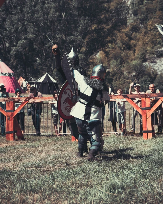 the knight stands ready to run to get into the gate