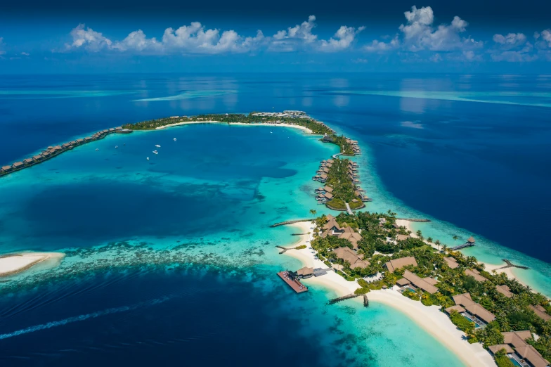 a small island near the ocean with houses