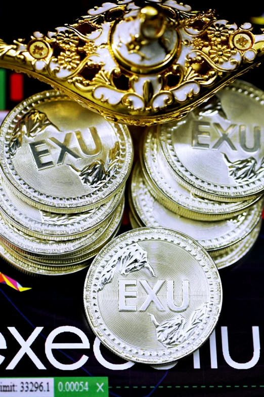 a bunch of small gold coins next to a money jar