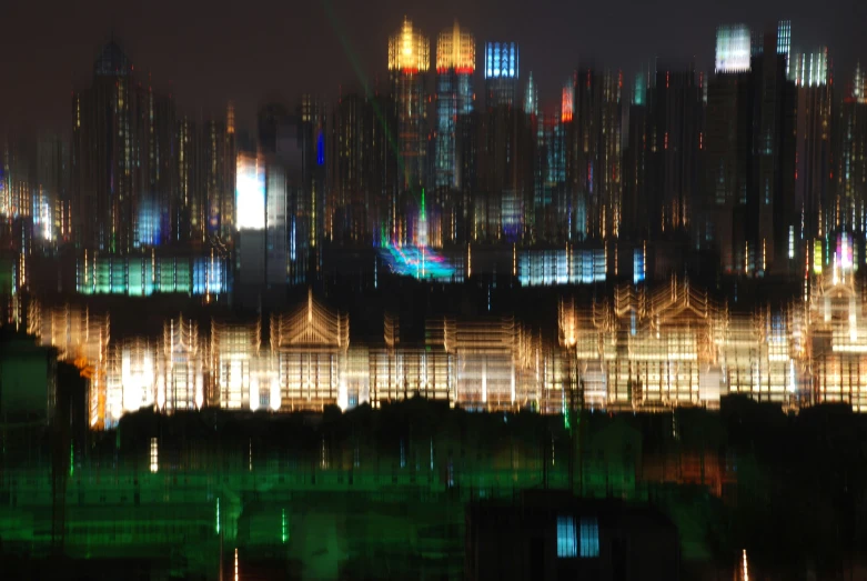 a large city skyline is lit up at night