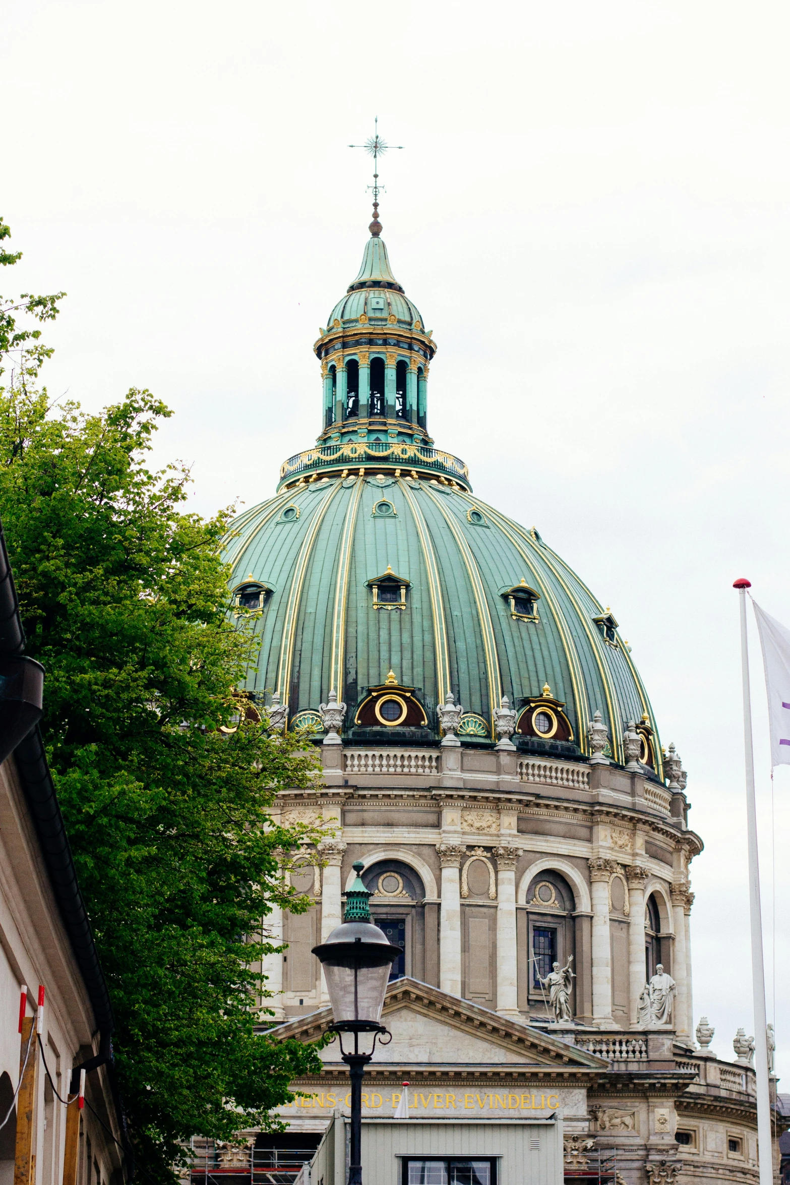 a dome on top of a building with a green roof