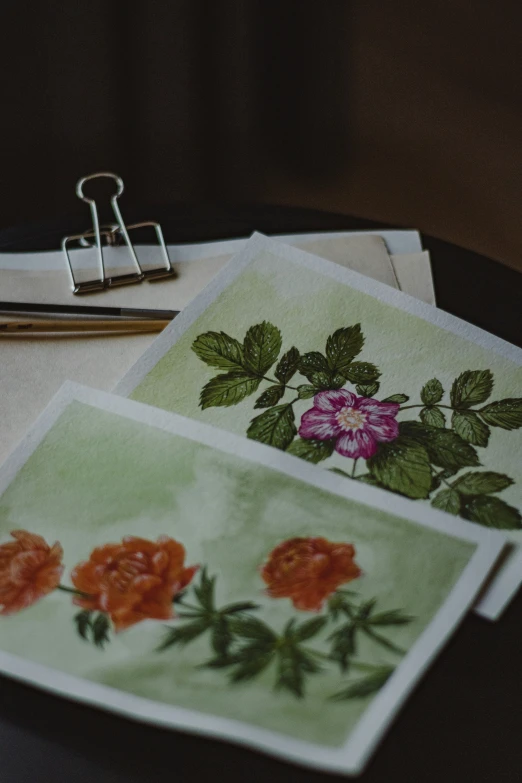 a group of papers with various pictures of flowers