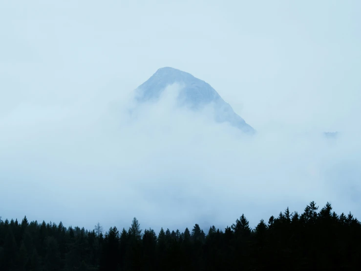 this is a large mountain covered in fog