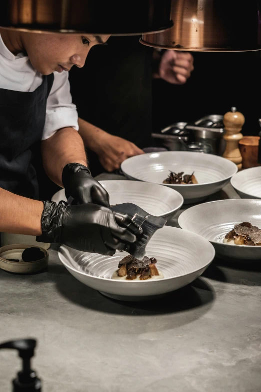 the chef is making some food on the plate