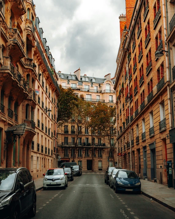 many cars and buildings lined up down the road