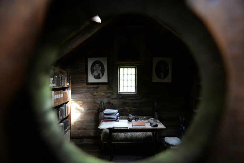 the view of the room through the hole in a house's wall