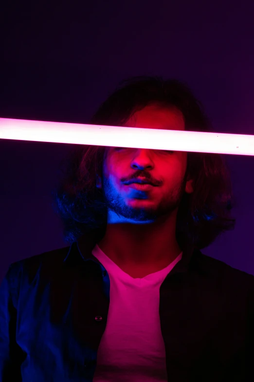 a man with long hair and light painting