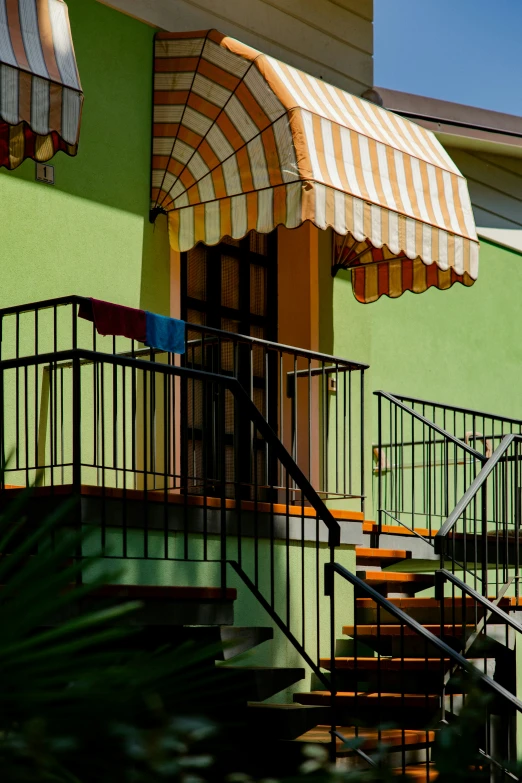 a small stair leading to a front entrance