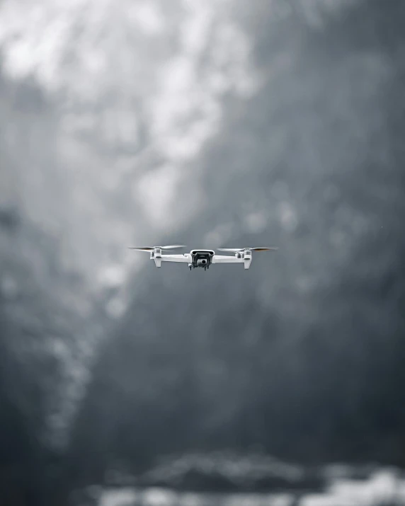 an airplane flying through the cloudy sky during daytime