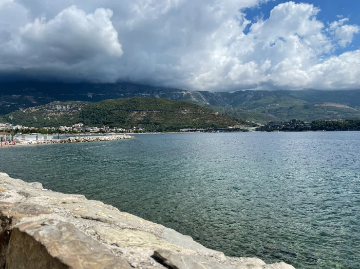 a large body of water on a partly cloudy day