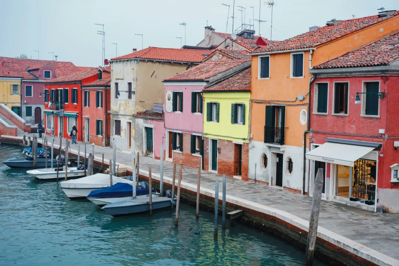 a harbor with several different colored buildings on both sides