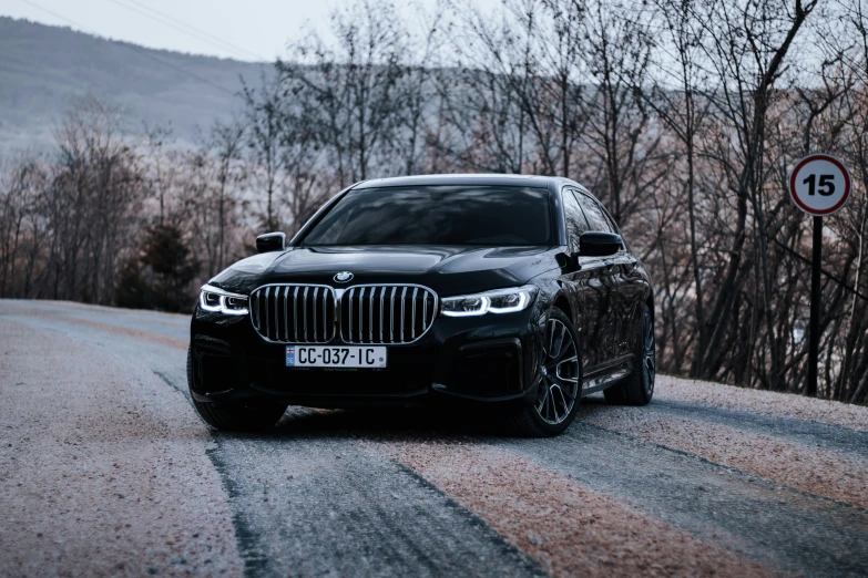 a bmw is parked on the side of a road