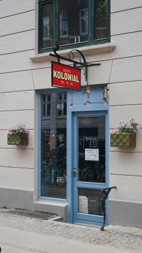 this is the entrance to the kolonian with a blue door