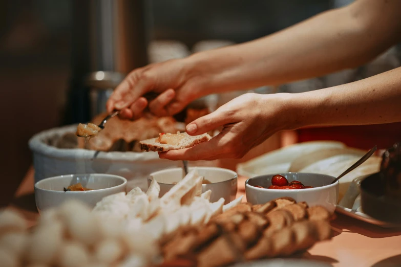 people eating together with lots of food on the table