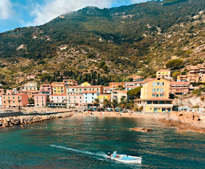 an old town along the shore has boats on it