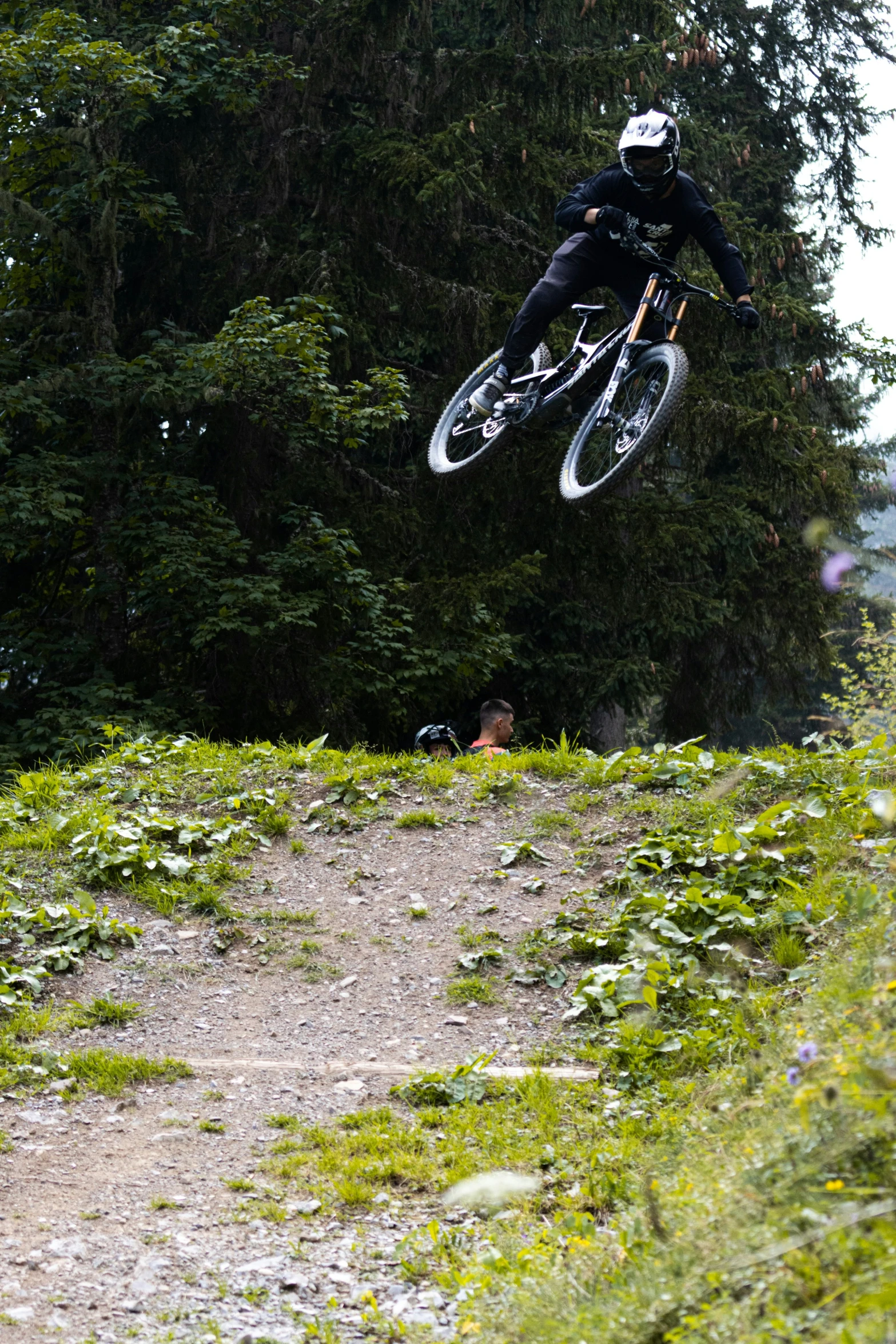 a man that is jumping his bike in the air