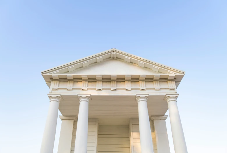 a white building with several columns on top