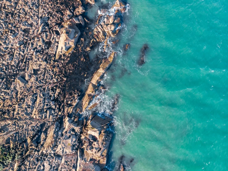 an aerial view of the ocean, from above