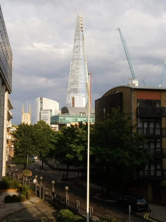 an image of city street with tall buildings