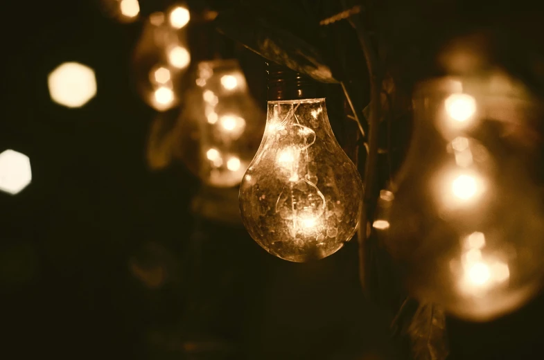 close up of a string of vintage bulb lights