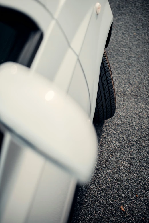 the bottom end of a car with its tire rim missing