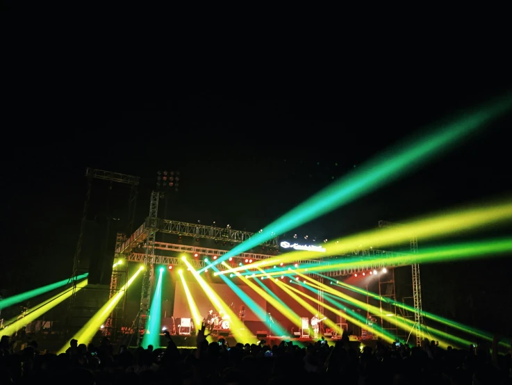 a lot of colorful lights being projected on a stage