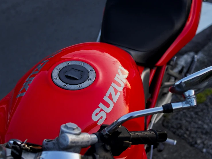 the seat of a red suzuki motorcycle