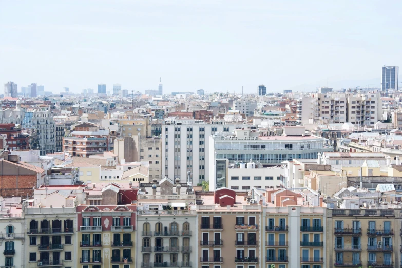 the city skyline with many tall buildings and blue sky