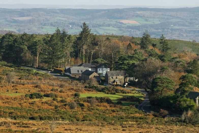 a rural countryside setting with mountains in the background