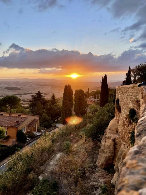 a mountain view at sunset over a village