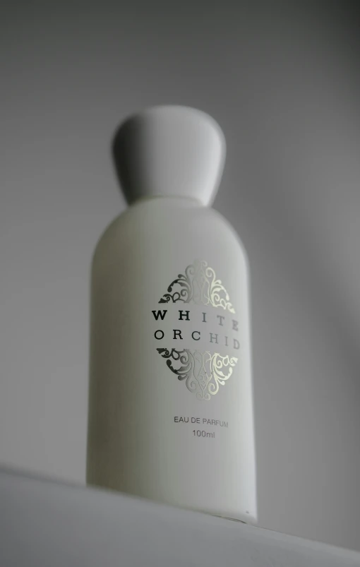a bottle of white orchid hand lotion on top of a counter