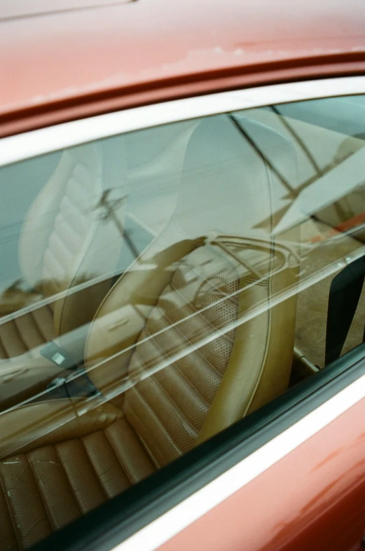 red vehicle showing the steering wheel inside