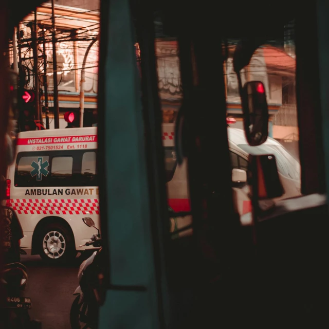 an ambulance is driving down a city street