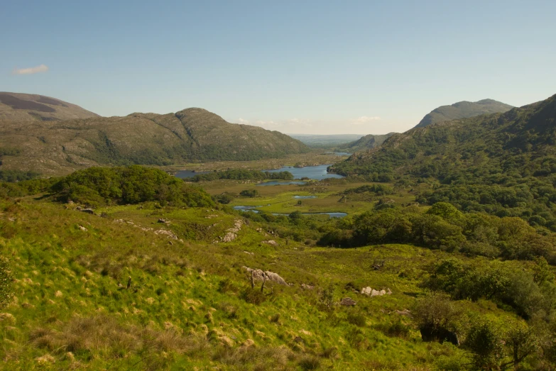 a view of some mountains and a body of water