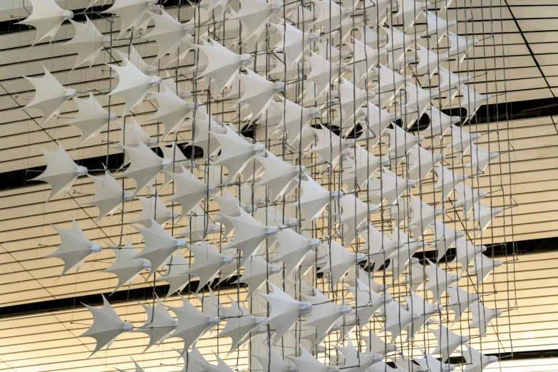 a large white sculpture has lots of stars on it