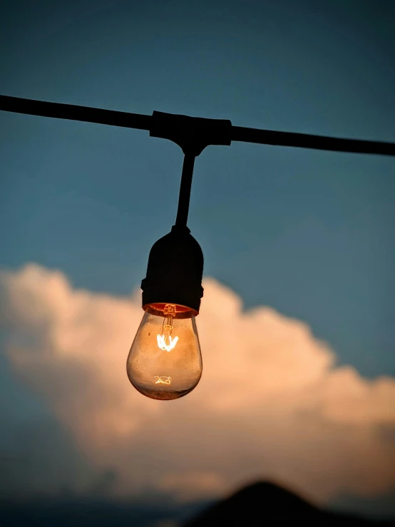 a light bulb hanging down off a wire
