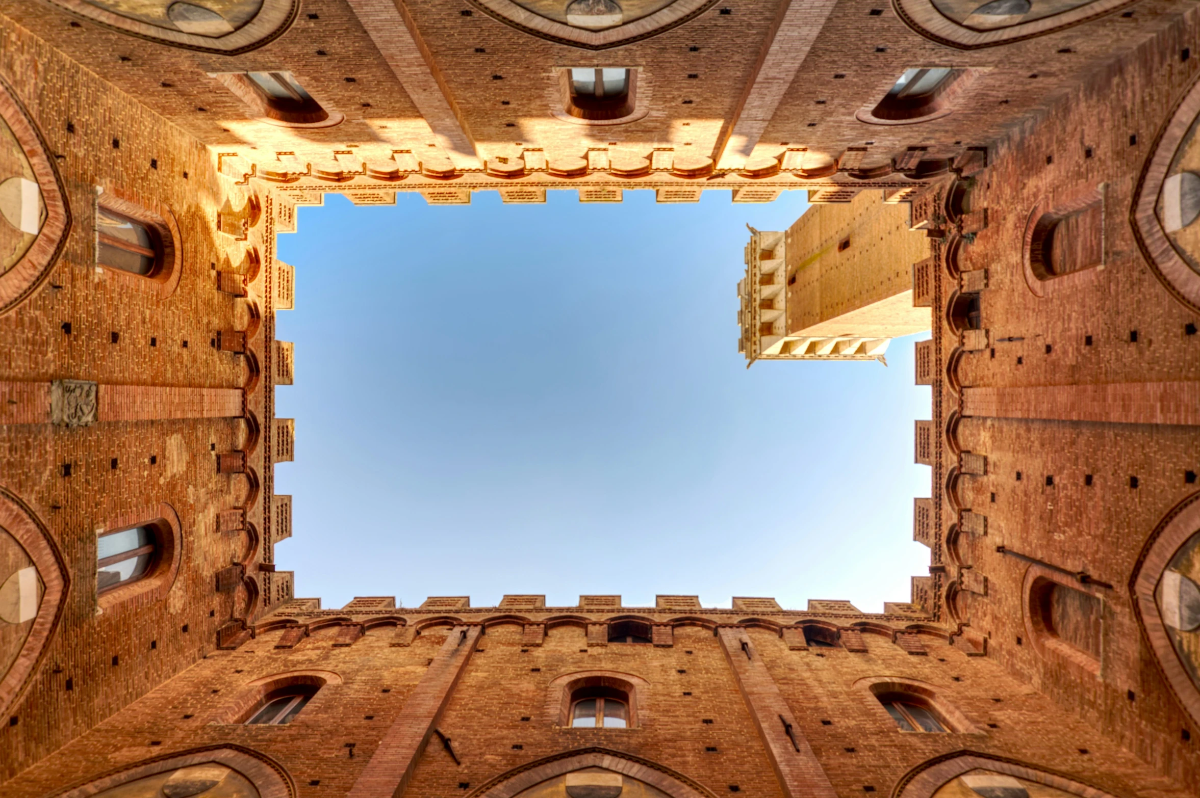 a view looking up into a large clock tower