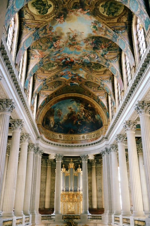 the interior of a very ornate church with a pipe organ