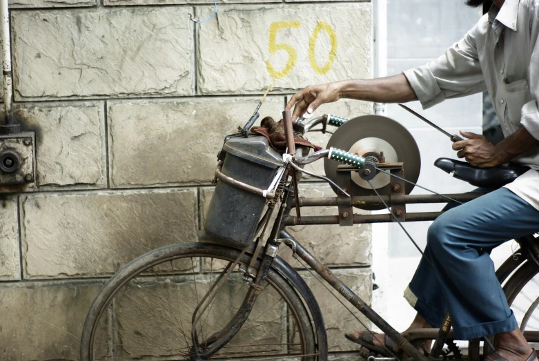 a man sits on the back of a bike