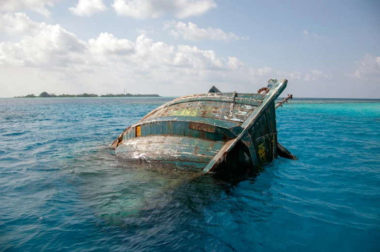 a boat sitting in the middle of a body of water