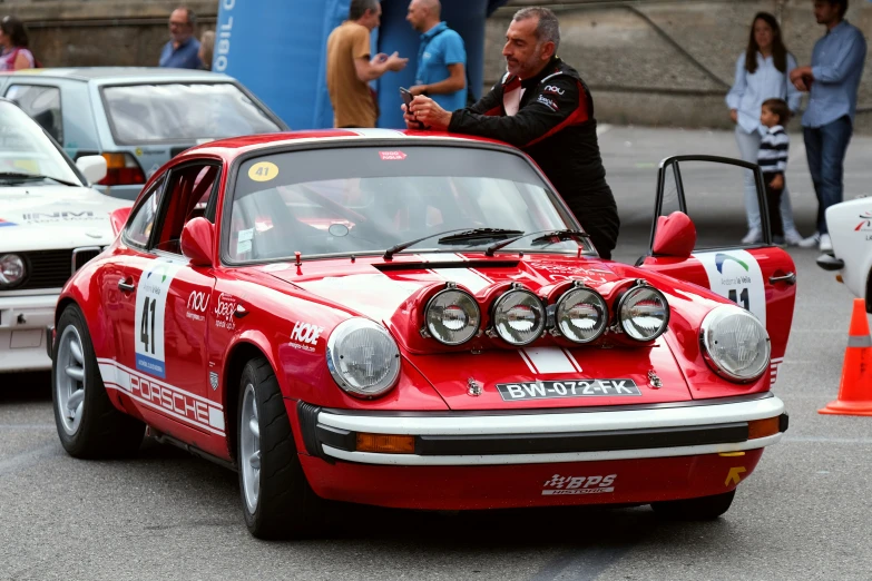 an old racing car has headlights up on it