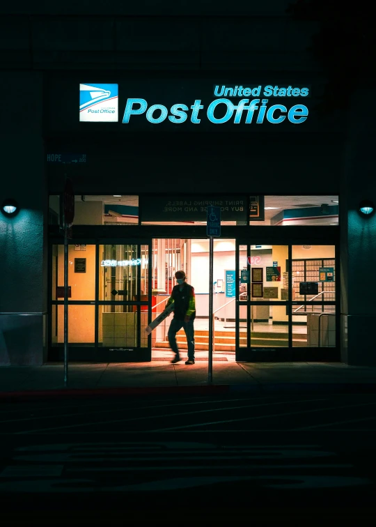 a man walking out of a post office