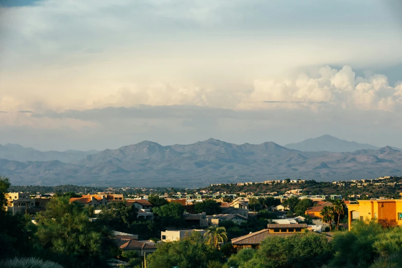 an aerial view of mountains from a small city