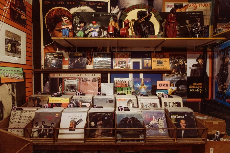 the shelf is full of various books on display