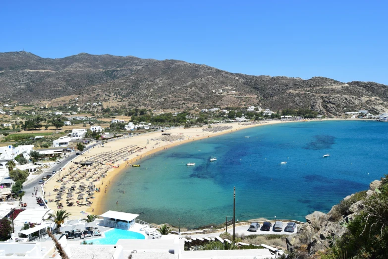 a view from atop a hill overlooking a beach