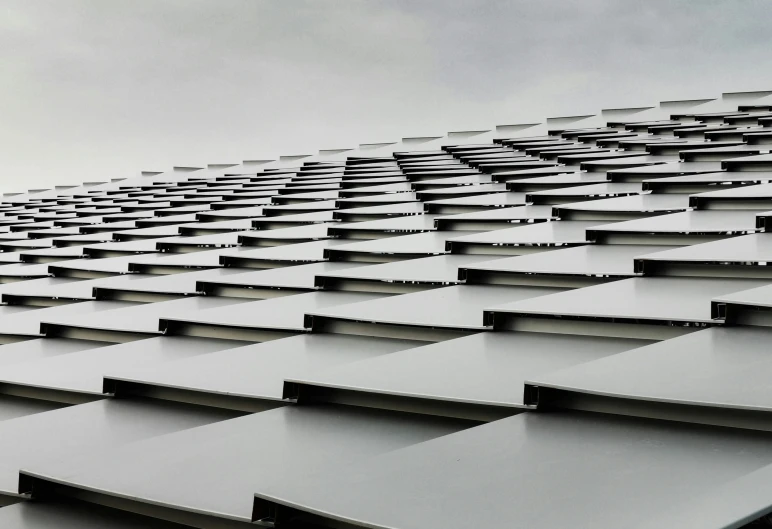 a black and white image of a very large building