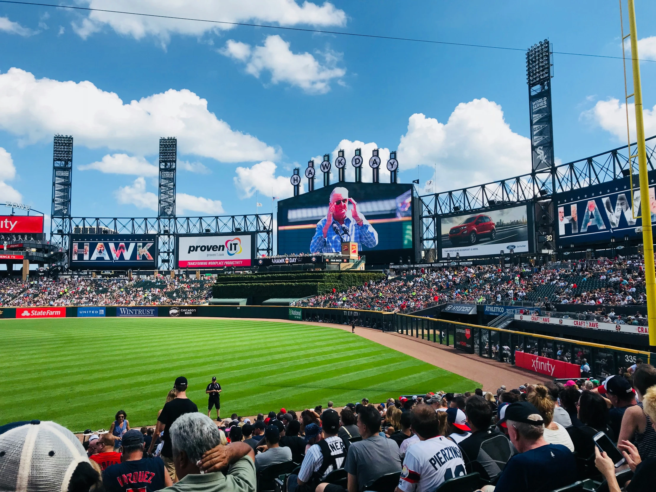 baseball stadium full of people watching a crowd