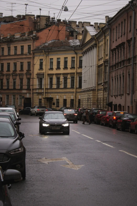 a bunch of cars that are driving down the road