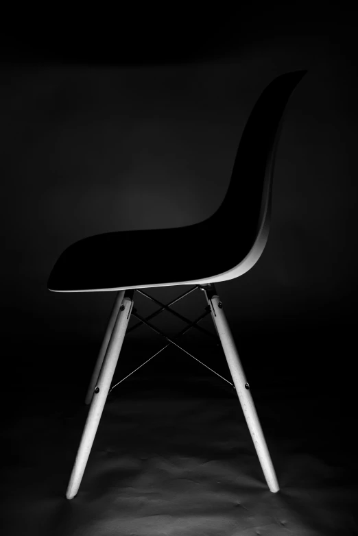 a black chair sitting on top of a table